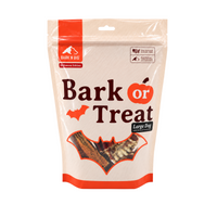 A stand-up pouch of Bark N' Big 'Bark or Treat' Halloween treats for large dogs, featuring a cream background with orange accents and a window showing the treats inside.